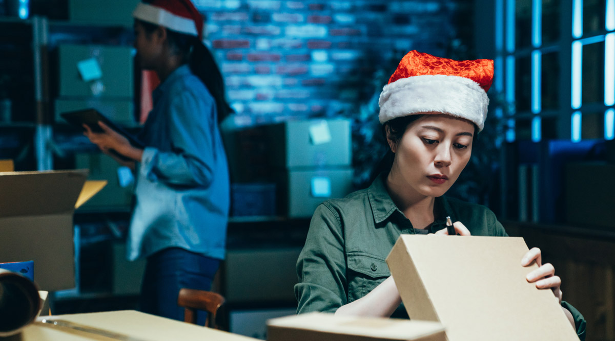 Warehouse worker wearing a Santa hat